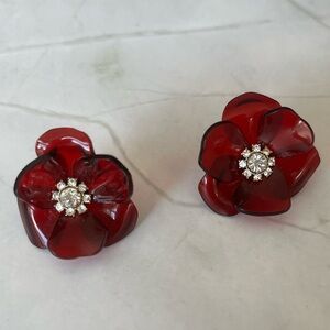 Red Lucite Flower post earrings with crystal accents.